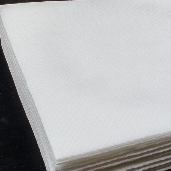 Detalle de servilleta personalizada con impresión CMYK - textura punta a punta de calidad